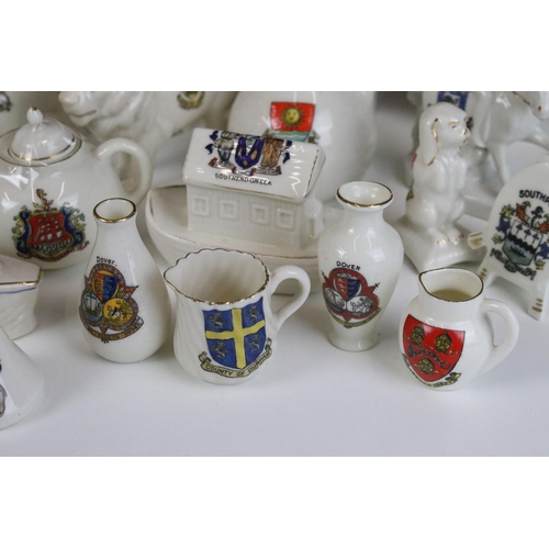 93 - A large selection of crested ware to include Exeter, Southend on Sea, Norwich and Dover examples (3 ... 