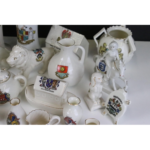 93 - A large selection of crested ware to include Exeter, Southend on Sea, Norwich and Dover examples (3 ... 