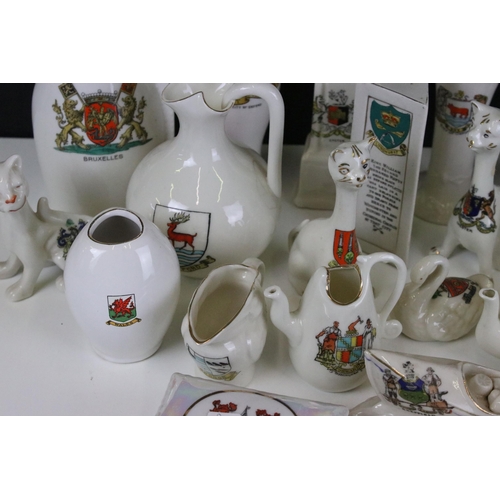 93 - A large selection of crested ware to include Exeter, Southend on Sea, Norwich and Dover examples (3 ... 