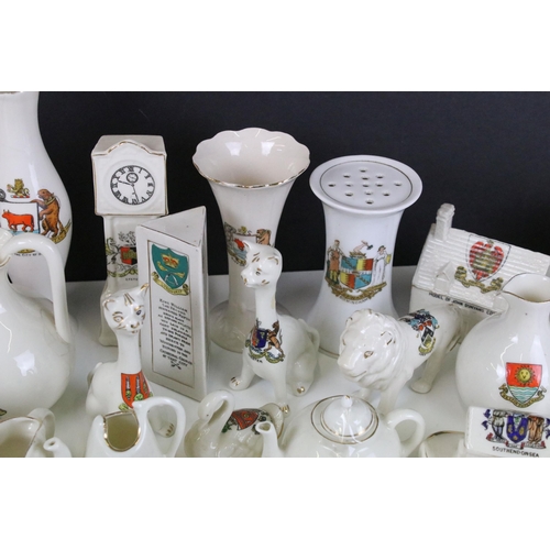 93 - A large selection of crested ware to include Exeter, Southend on Sea, Norwich and Dover examples (3 ... 