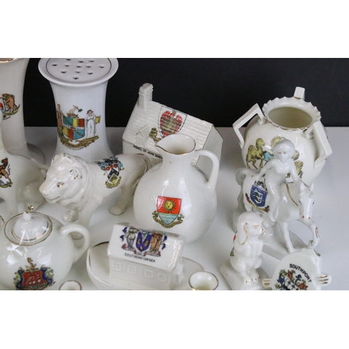 93 - A large selection of crested ware to include Exeter, Southend on Sea, Norwich and Dover examples (3 ... 