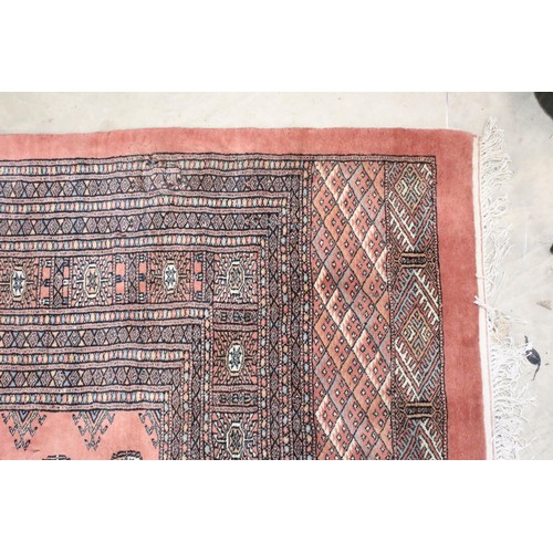 644 - Large Middle Eastern carpet rug having a red ground with medallions to central panel with blue and c... 