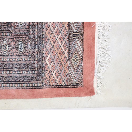 644 - Large Middle Eastern carpet rug having a red ground with medallions to central panel with blue and c... 