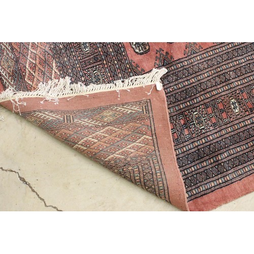 644 - Large Middle Eastern carpet rug having a red ground with medallions to central panel with blue and c... 