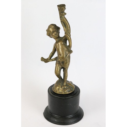 274 - Gilt metal figure of a putti holding an artist's palette, mounted to onyx base, 11.5cm high together... 