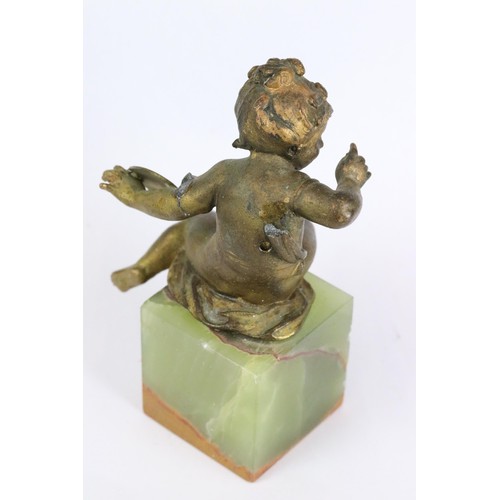 274 - Gilt metal figure of a putti holding an artist's palette, mounted to onyx base, 11.5cm high together... 