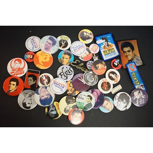 356 - Collection of Elvis Presley related collectables to include a selection of pin badges, three LP's an... 