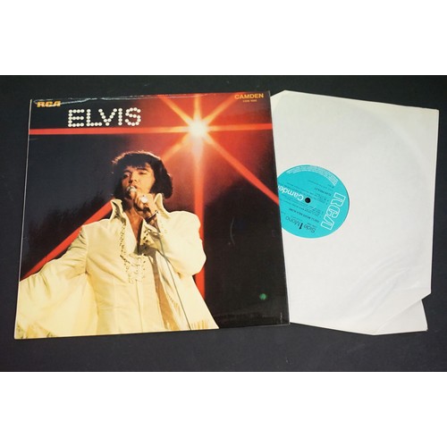 356 - Collection of Elvis Presley related collectables to include a selection of pin badges, three LP's an... 