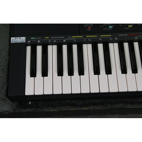 455 - Yamaha PSR-70 piano keyboard set within a fitted case.