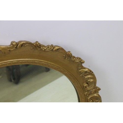 550 - Three mirrors to include an ornate oval gilt wood example together with oval oak frame mirror and ov... 