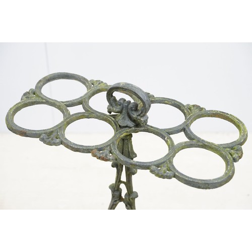 574 - Late 19th century cast iron eight division umbrella / stick stand with drip tray, 68cm high x 46.5cm... 