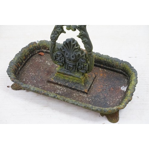 574 - Late 19th century cast iron eight division umbrella / stick stand with drip tray, 68cm high x 46.5cm... 