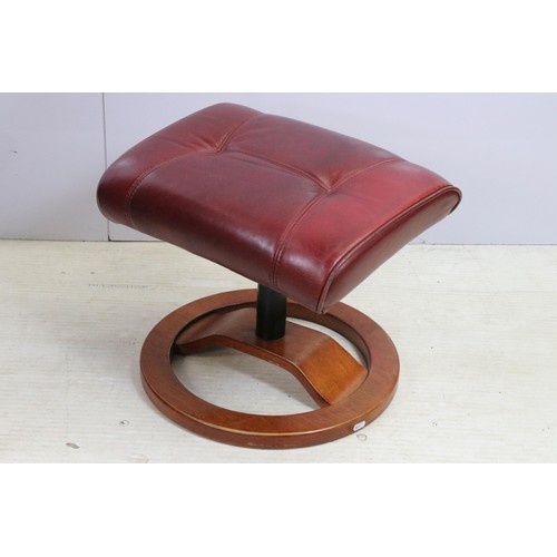 640 - Red leather reclining chair with matching footstool, the chair 102cm high x 80cm wide x 49cm deep