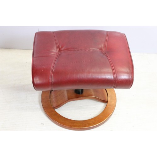 640 - Red leather reclining chair with matching footstool, the chair 102cm high x 80cm wide x 49cm deep