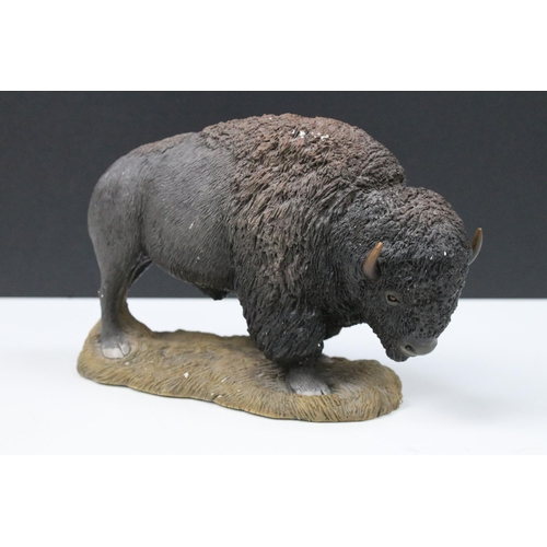 160 - Resin model of a bison by Sandra Brue, no. 1372/5000 and a resin model of a shepherd and sheepdog (2... 