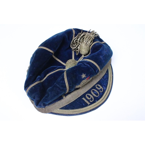 207 - Rugby / football - 1909 navy velvet cap, with gilt tassel, gilt embroidered with a dragon and dated ... 