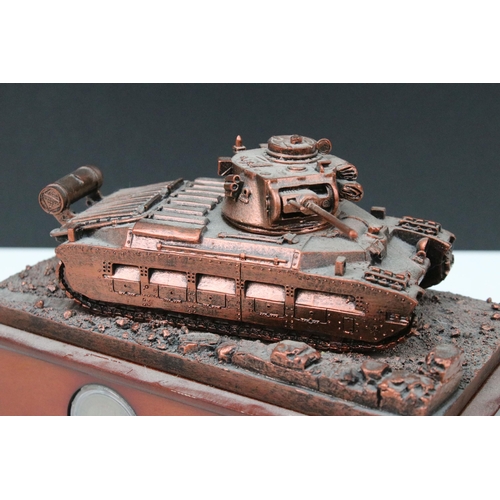 421A - Danbury Mint, Queen of the Desert resin sculpture of tank on plinth containing old and commemorative... 