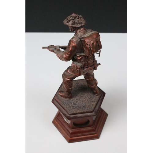 422A - Danbury Mint, The Liberator, World War II 1944 resin sculpture of standing soldier with gun on plint... 