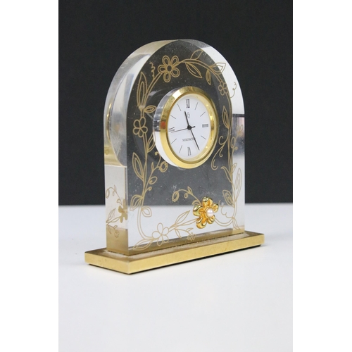 54 - Mikimoto timepiece (clock), the translucent arch shape with applied gilt flower head with pearl cent... 