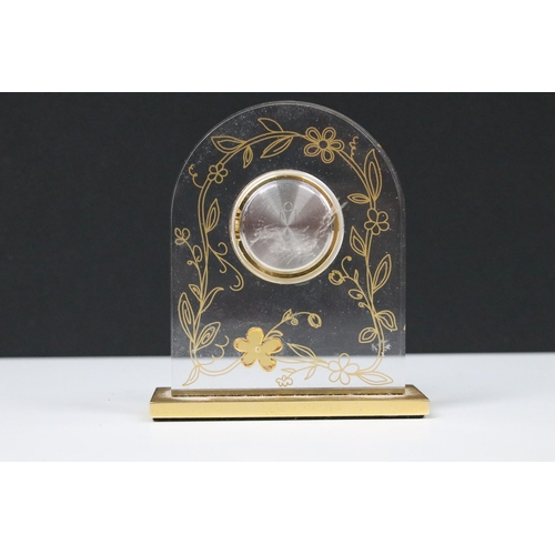 54 - Mikimoto timepiece (clock), the translucent arch shape with applied gilt flower head with pearl cent... 