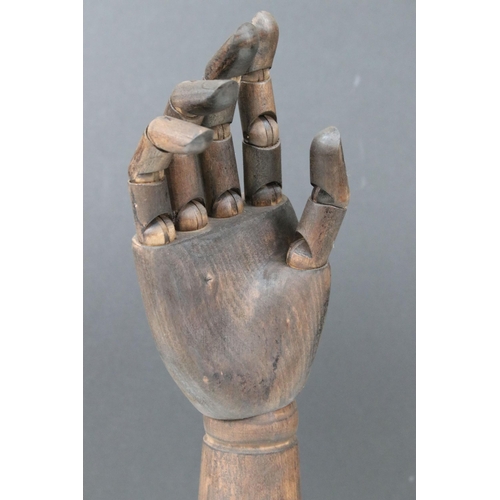 115 - Wooden articulated shop display hand, H 45cm