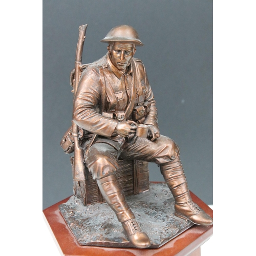 410A - Danbury Mint, World War 1 centenary resin sculpture of seated soldier on plinth containing old and c... 