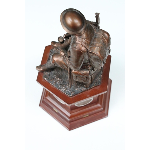 410A - Danbury Mint, World War 1 centenary resin sculpture of seated soldier on plinth containing old and c... 