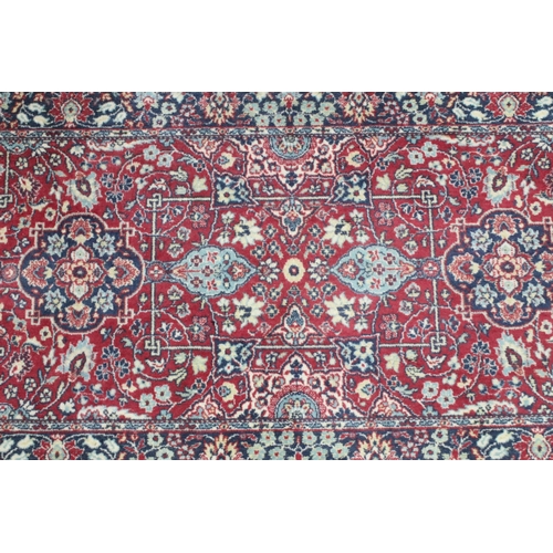 648 - Tabris Super red ground rug, with two central medallions within borders, 139 x 70cm and a red ground... 