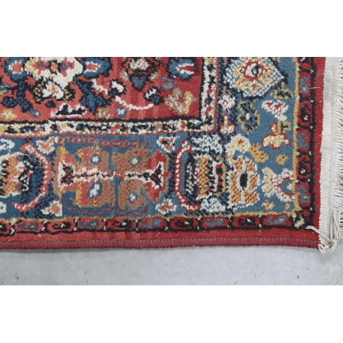 648 - Tabris Super red ground rug, with two central medallions within borders, 139 x 70cm and a red ground... 