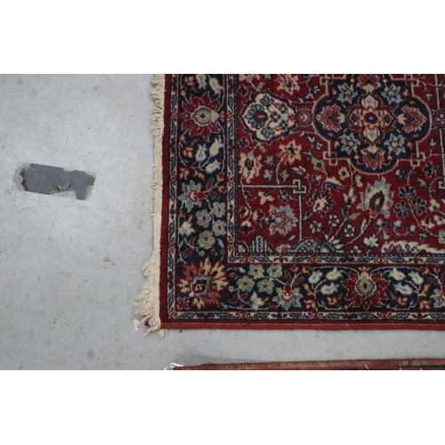 648 - Tabris Super red ground rug, with two central medallions within borders, 139 x 70cm and a red ground... 