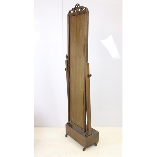 643 - Full length mahogany mirror with fret work pediment set on box plinth with castors, approx. H 172cm