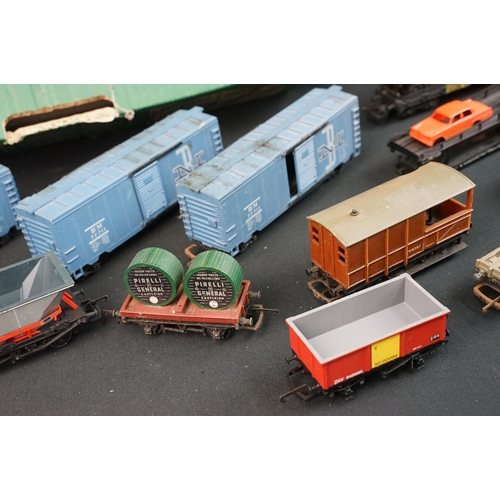 46 - Around 125 OO / HO gauge items of rolling stock to include car transporters, wagons, tankers and tru... 