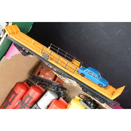 46 - Around 125 OO / HO gauge items of rolling stock to include car transporters, wagons, tankers and tru... 