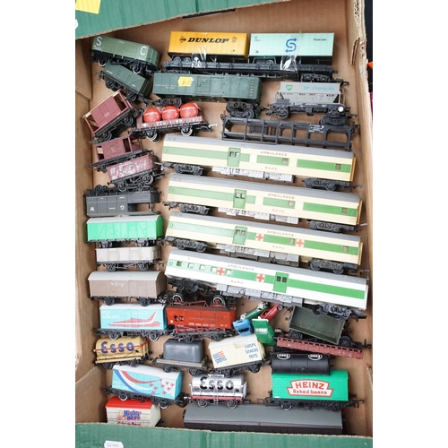 46 - Around 125 OO / HO gauge items of rolling stock to include car transporters, wagons, tankers and tru... 