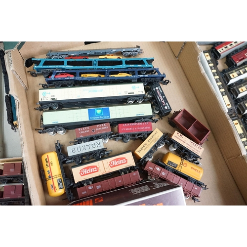 57 - Around 90 OO / HO gauge items of rolling stock featuring coaches, tankers and wagons including Lima,... 