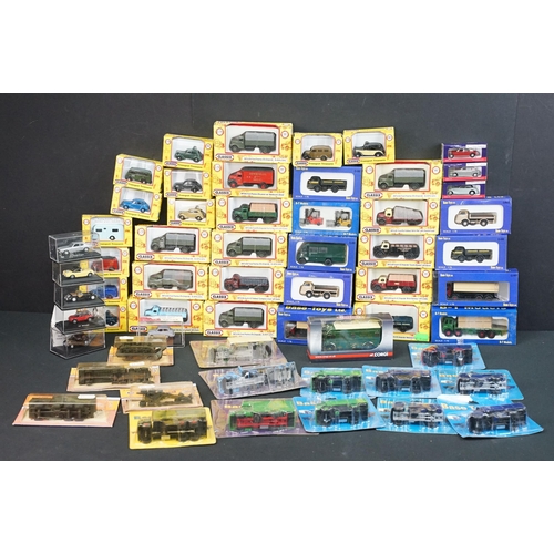 86 - Around 58 boxed / carded small scale diecast & plastic models to include Classix, Base Toys, Minitan... 