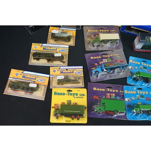86 - Around 58 boxed / carded small scale diecast & plastic models to include Classix, Base Toys, Minitan... 