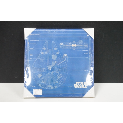 251 - Star Wars - 14 framed canvas Star Wars prints featuring Millennium Falcon Blueprints, Kylo Ren Fire,... 