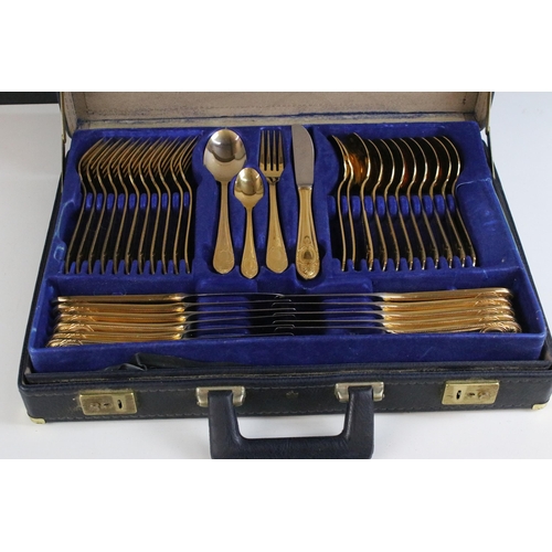 312 - Bestecke Solingen gold plated cutlery set in fitted brief case together with a wooden canteen of sta... 