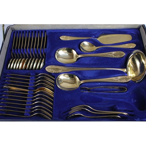 312 - Bestecke Solingen gold plated cutlery set in fitted brief case together with a wooden canteen of sta... 