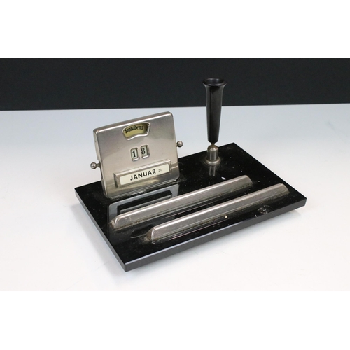 109 - Art Deco chrome and black opaque glass desk stand with perpetual calendar, pen holder and pen tray, ... 