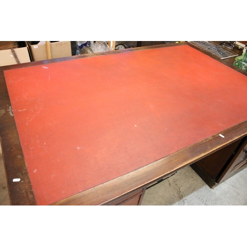 611 - 20th Century mahogany partners twin pedestal desk having a red leather top, with each pedestal havin... 