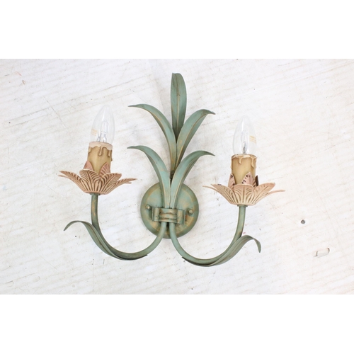 614 - Three floral design wall sconces with painted details. 30cm high.