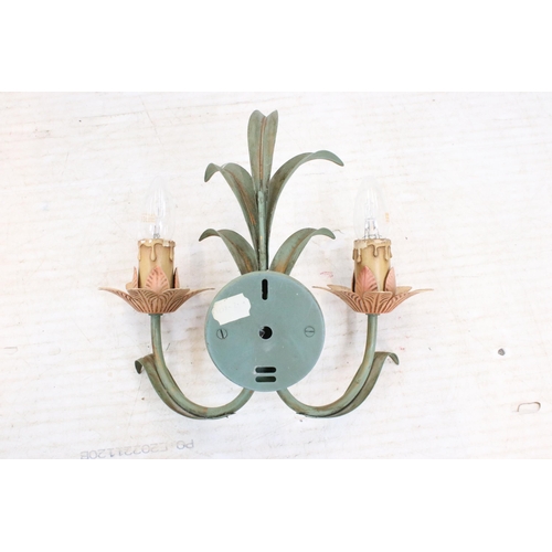 614 - Three floral design wall sconces with painted details. 30cm high.