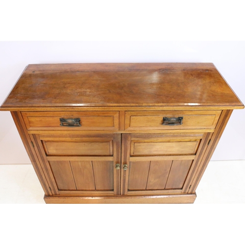 621 - 19th Century Victorian mahogany sideboard having twin cupboard doors below two drawers raised on pli... 