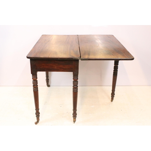 610 - 19th Century mahogany side table having a folding top with single drawer raised on turned legs with ... 