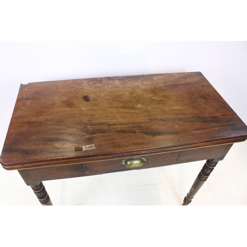 610 - 19th Century mahogany side table having a folding top with single drawer raised on turned legs with ... 