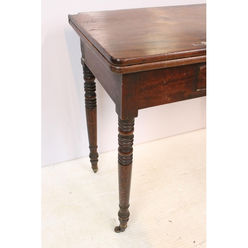 610 - 19th Century mahogany side table having a folding top with single drawer raised on turned legs with ... 