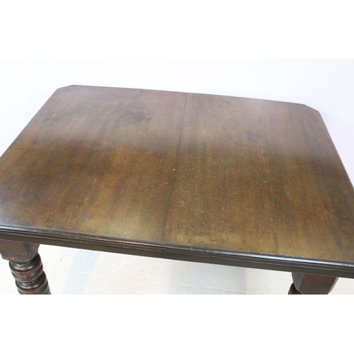 615 - 19th Century Victorian oak extending dining table having canted corners, turned legs and ceramic cas... 