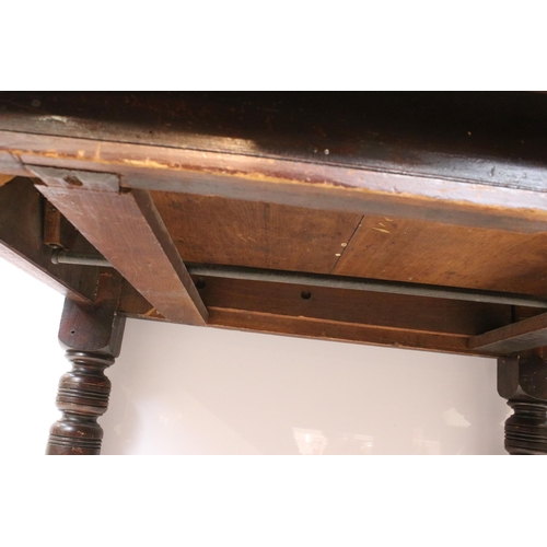 615 - 19th Century Victorian oak extending dining table having canted corners, turned legs and ceramic cas... 